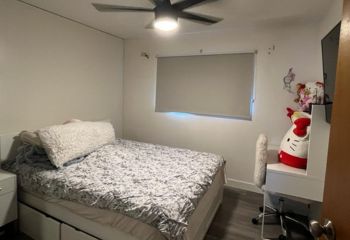 Custom blackout roller shades installed on a kids bedroom window in a Laguna Niguel home.
